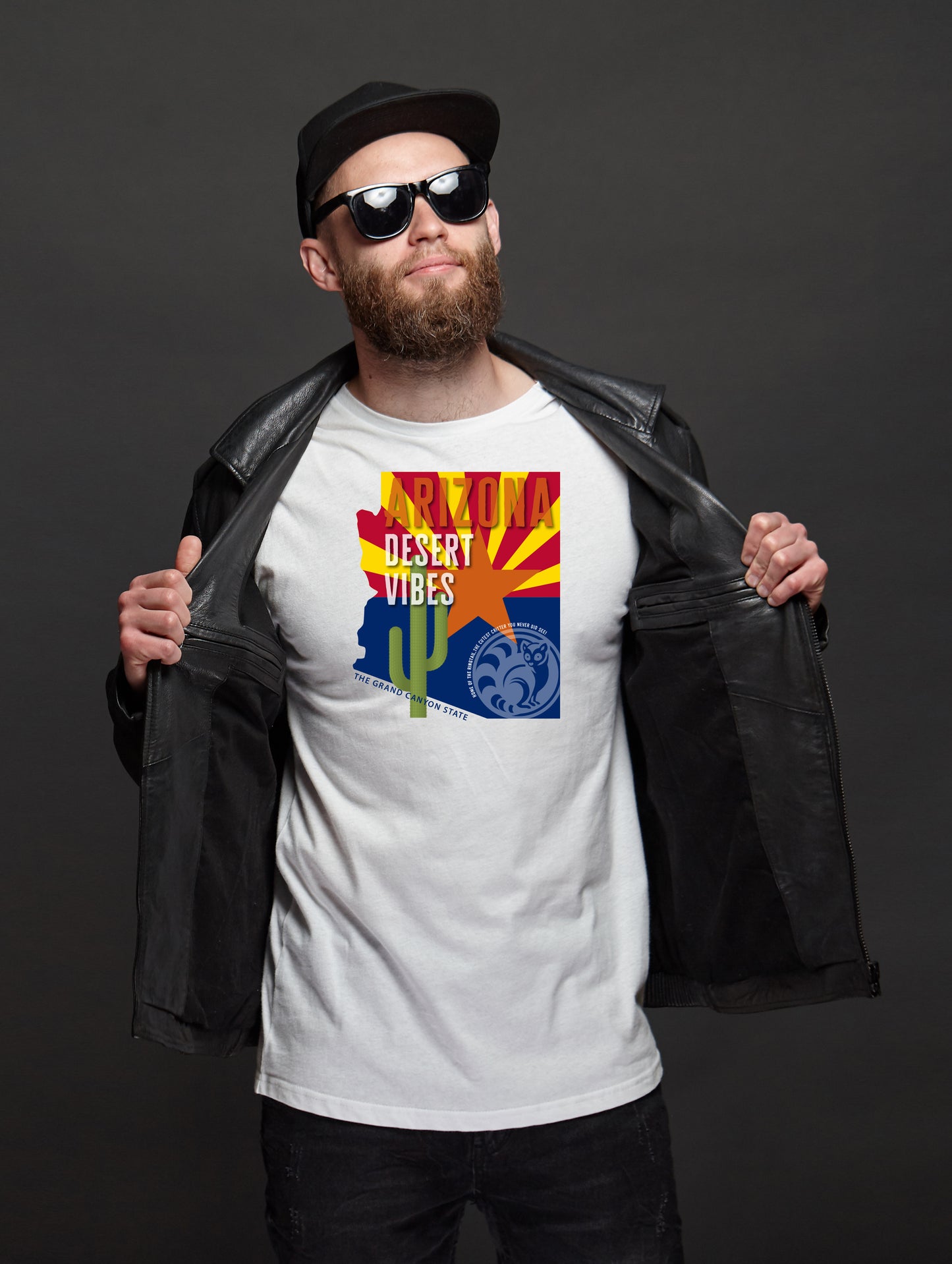Man wearing a white t-shirt with a graphic design of an Arizona flag and 'Desert Vibes' text.