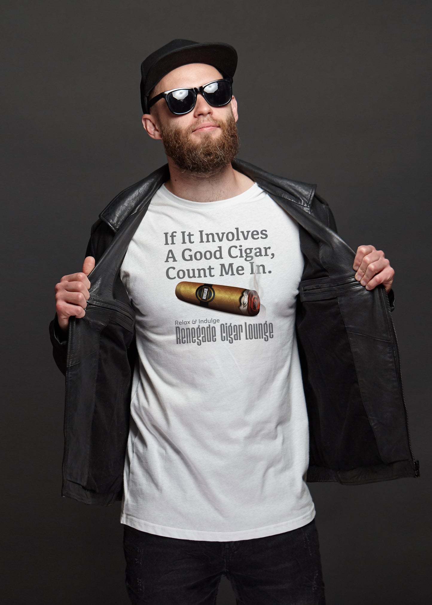 Man wearing a white t-shirt with a cigar-themed design and text, holding a black leather jacket.