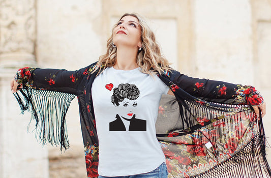 Woman wearing a white t-shirt with a graphic design of Lucille Ball and a floral jacket in an urban setting.