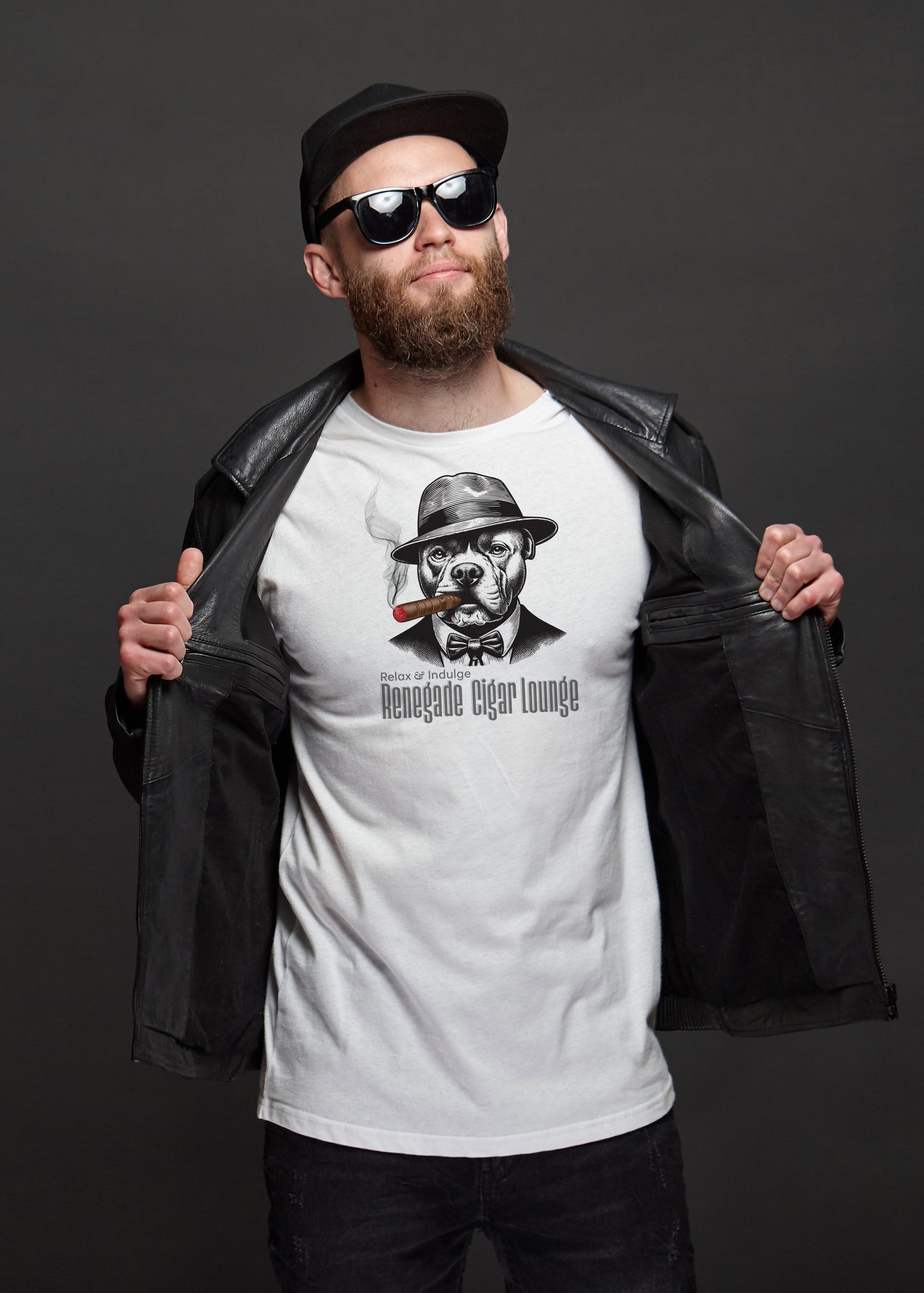 Man wearing a white t-shirt with a bull dog smoking a cigar graphic design and sunglasses, holding a black leather jacket.
