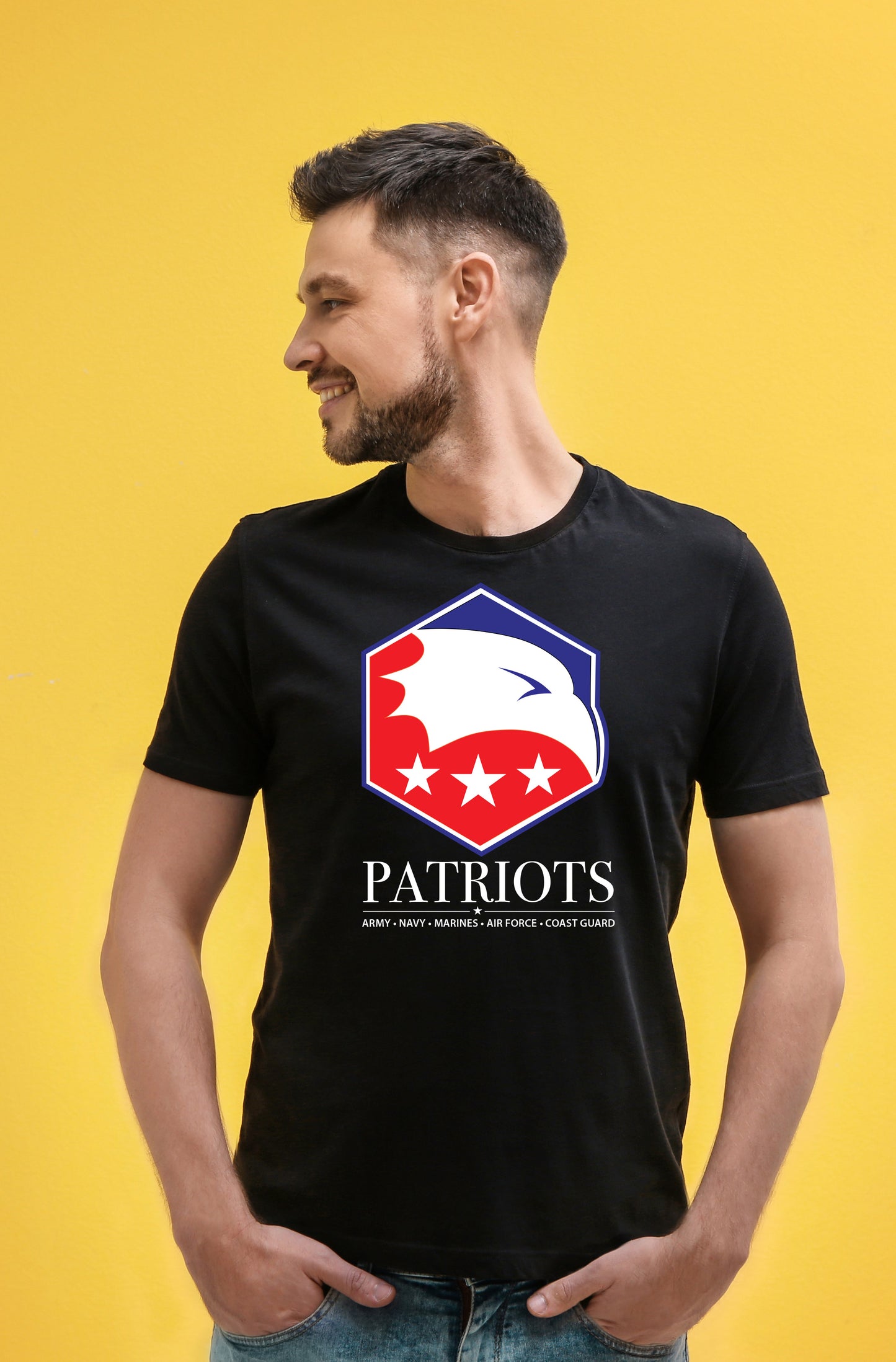 Man wearing a black t-shirt with a 'Patriots Day' logo on a yellow background