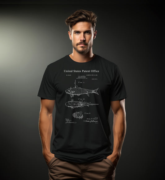 Man wearing a black t-shirt with a fish diagram and text on a dark background
