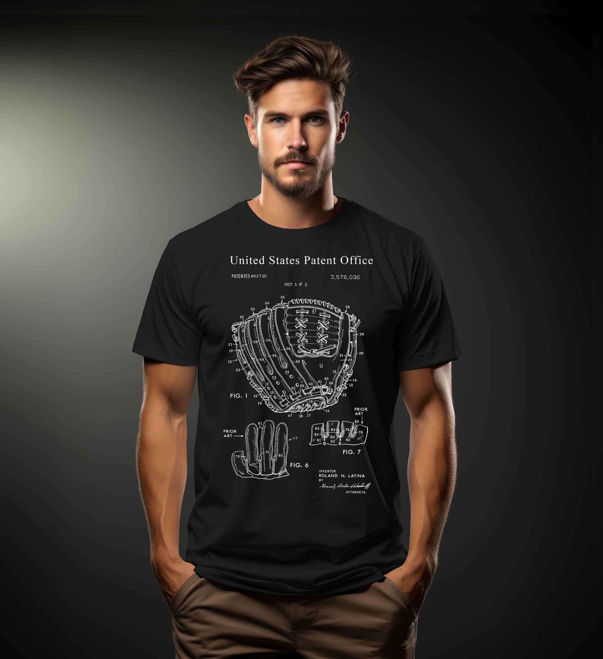 Man wearing a black t-shirt with a baseball glove design and 'United States Patent Office' text on a dark background