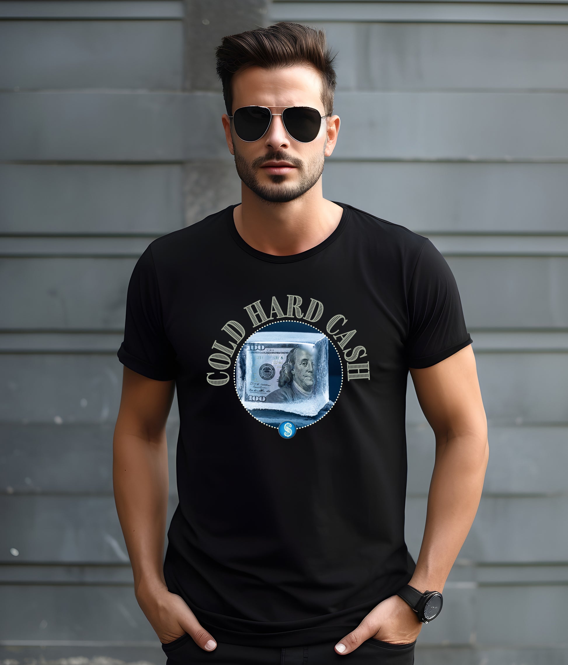 Man wearing a black t-shirt with 'Cold Hard Cash' design against a gray wall.