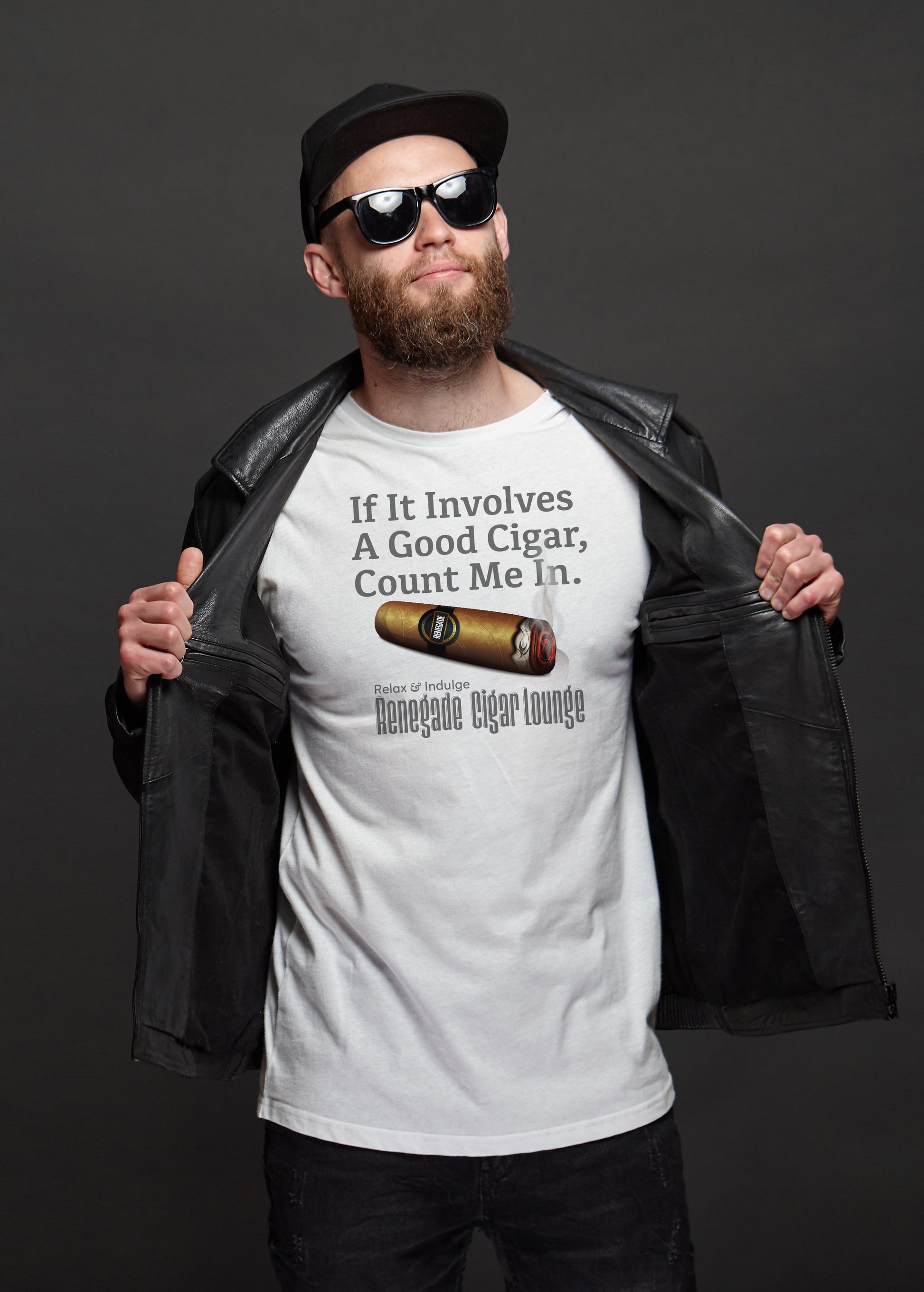 Man wearing a white t-shirt with a cigar-themed design and text, holding a black leather jacket.