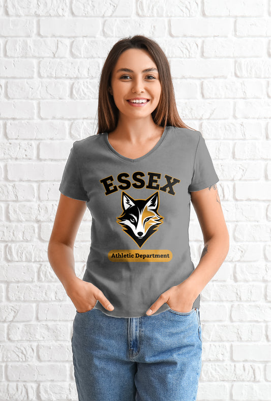 Woman wearing a gray t-shirt with 'Essex Athletic Department' logo against a white brick wall.
