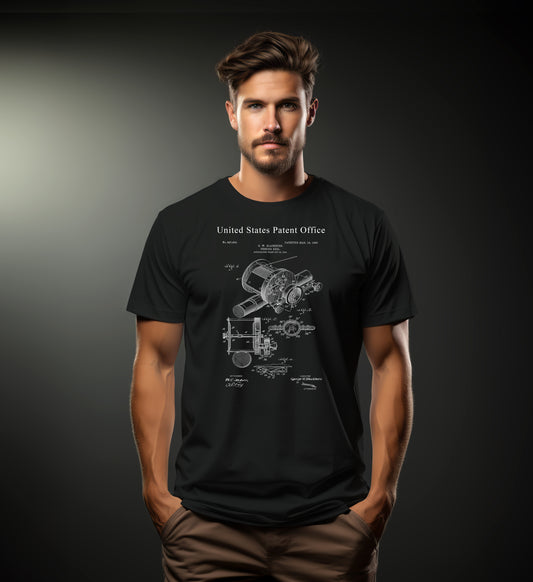 Man wearing a black t-shirt with a technical drawing and 'United States Patent Office' text on a dark background