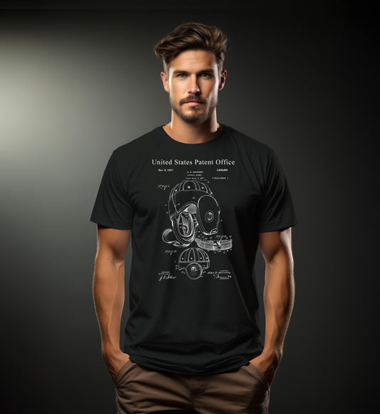 Man wearing a black t-shirt with a technical patent drawing design on a dark background