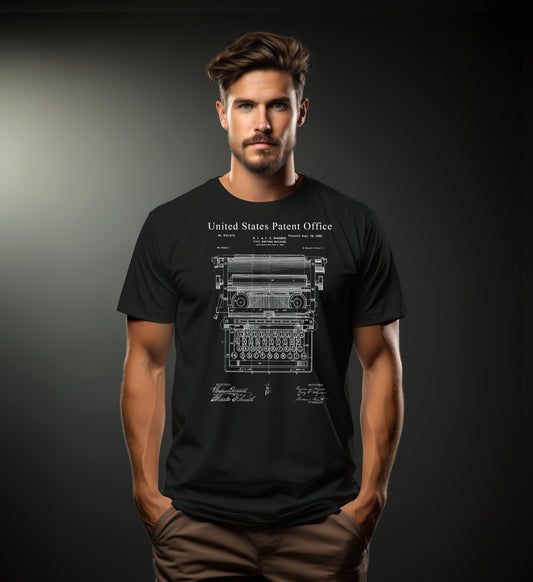 Man wearing a black t-shirt with a typewriter design and 'United States Patent Office' text on a dark background