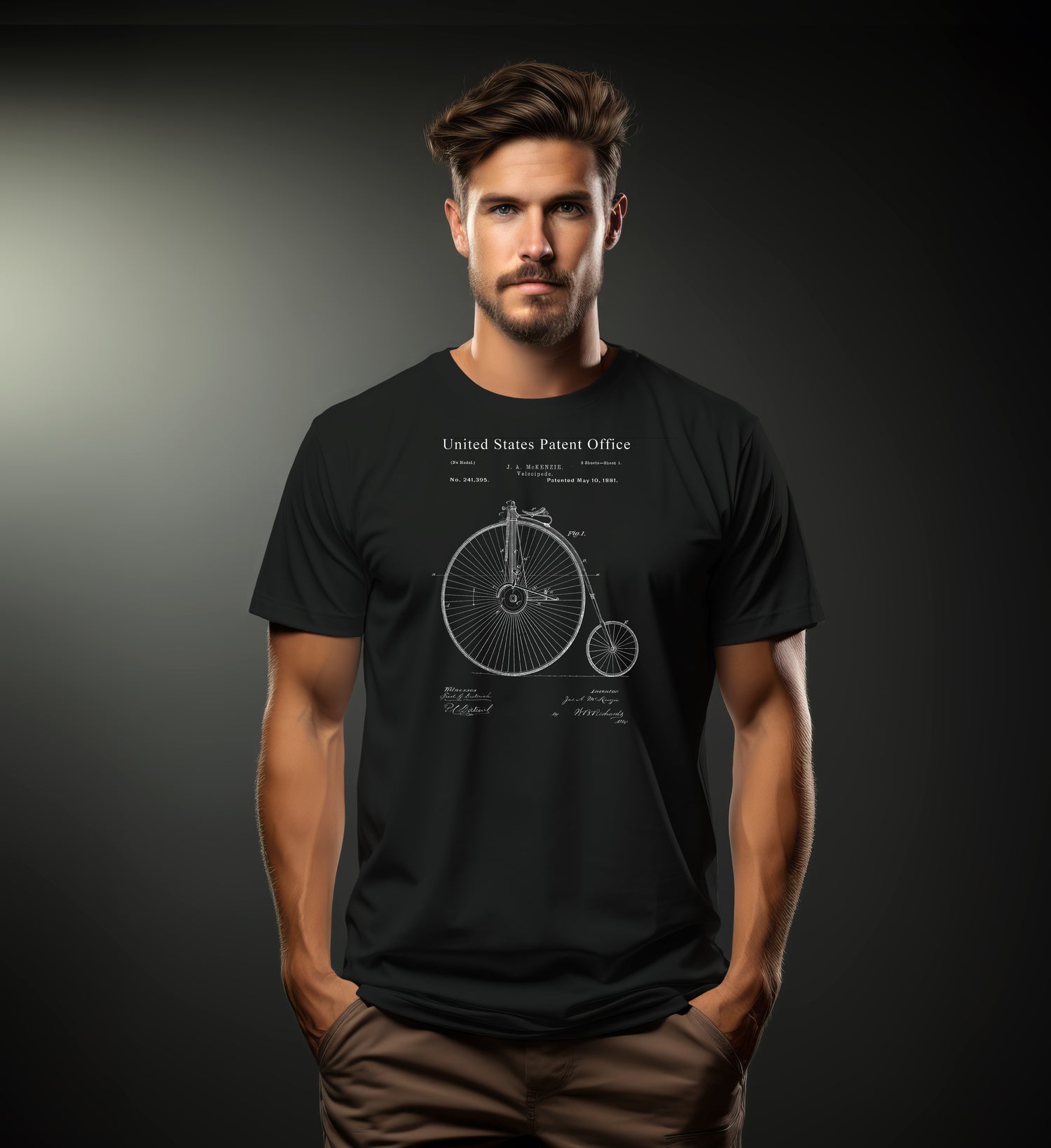 Man wearing a black t-shirt with a bicycle design and text on a dark background